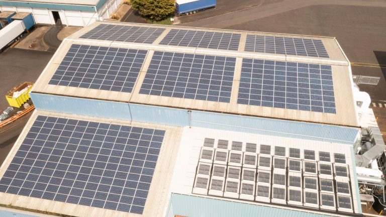Roof covered with solar panels, utilising renewable energy.