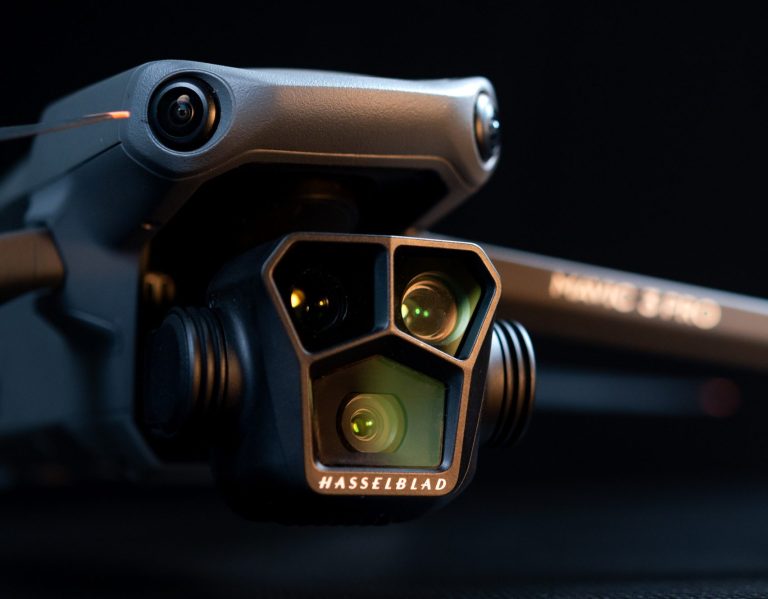 Close-up of a drone camera with dual lenses and a sleek design.