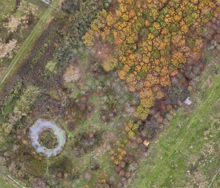 A close-up view of a telecommunications tower against a clear blue sky.